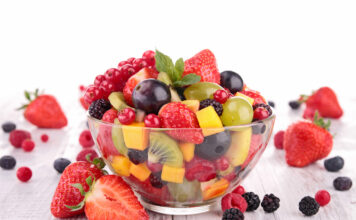 Colorful and nutritious fruit salad in a bowl, offering a variety of health benefits.