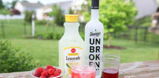 A refreshing vodka strawberry lemonade: a delightful blend of smooth vodka, ripe strawberries, and tangy lemonade, creating a vibrant and flavorful cocktail.