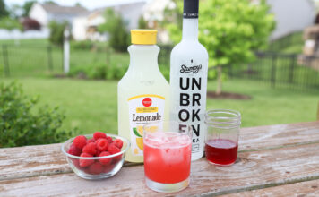 A refreshing vodka strawberry lemonade: a delightful blend of smooth vodka, ripe strawberries, and tangy lemonade, creating a vibrant and flavorful cocktail.