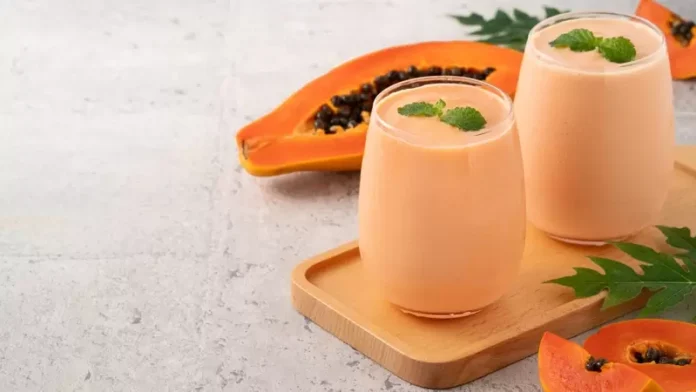 Refreshing papaya smoothie in a glass, perfect for a healthy breakfast or snack.