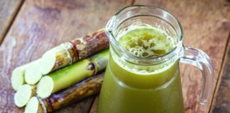 Refreshing sugarcane juice served in a glass with a slice of lime - a delicious and natural beverage recipe for a hot summer day