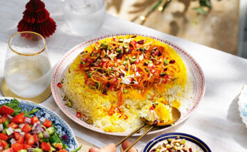 Exquisite Persian Jeweled Rice - A vibrant and flavorful dish adorned with a colorful array of nuts, fruits, and aromatic spices, perfect for special occasions. Indulge in this delightful Persian culinary masterpiece!